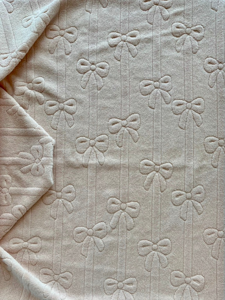 Peach Bows on a String hooded bath towel
